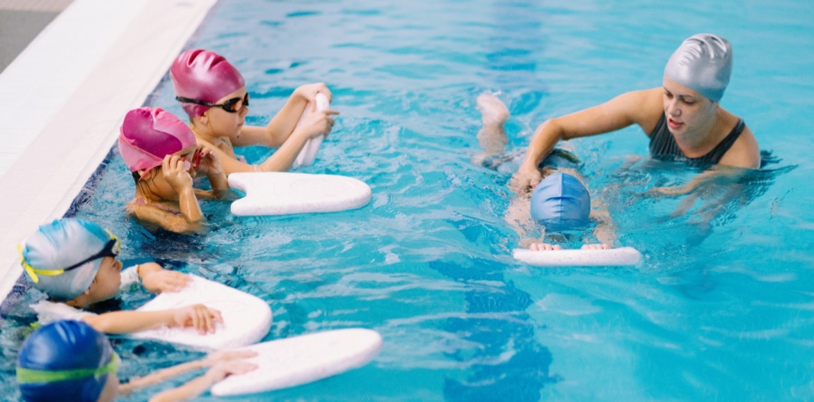 kids learning how to swim | SeaShore Realty
