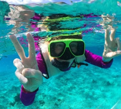 girl snorkeling in the ocean | SeaShore Realty