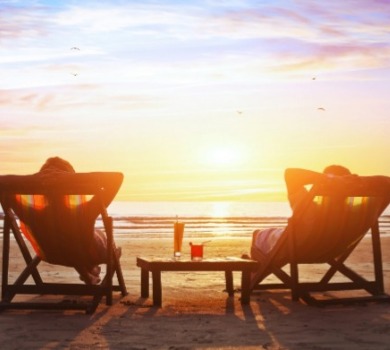 two people enjoying Topsail Island sunset on the beach | SeaShore Realty