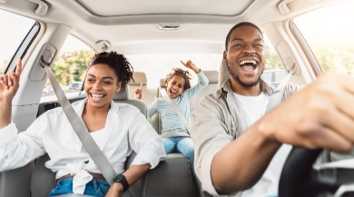 family riding in a car | seashore realty