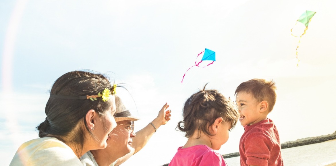 family flying kite on topsail beach | Seashore Realty