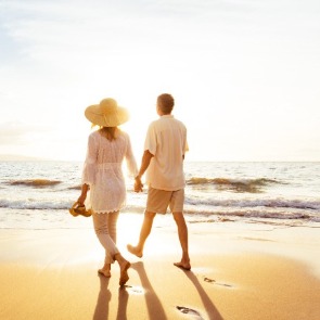 couple walking on the beach | seashore realty