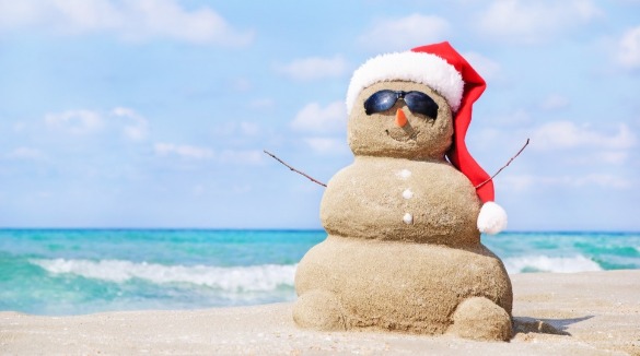 sand snowman on beach | SeaShore Realty